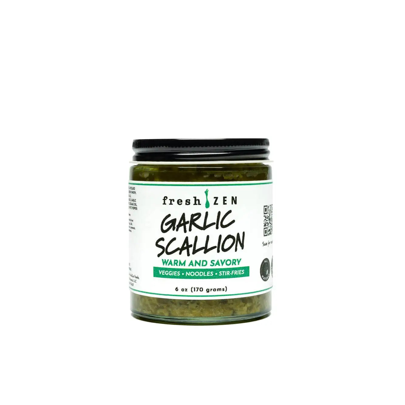 A glass jar of fresh zen garlic scallion sauce with a black lid and white label containing chopped garlic scallions